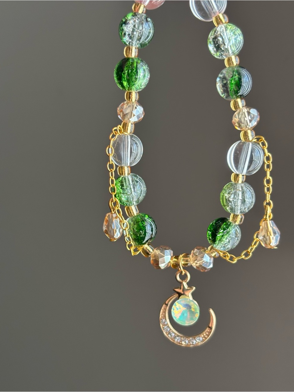 Hand Crafted Gold-tone Green and Clear Beaded Moon Pendant stretch bracelet - Picture 2 of 3